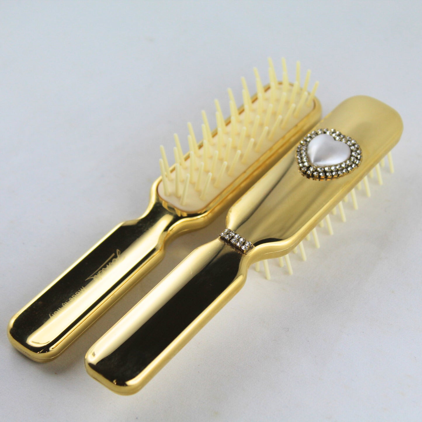 Spazzola oro con perla a cuore e Swarowski